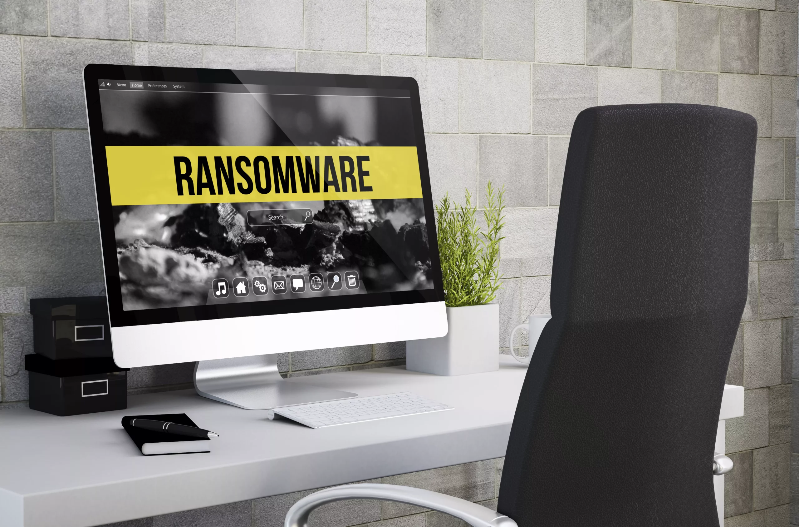 Computadora de escritorio con fondo de pantalla mostrando Ransomware